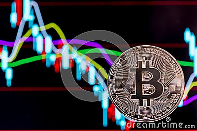 Bitcoin with colorful charts in the background Stock Photo