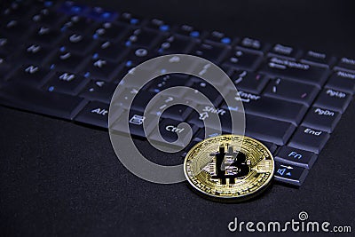 Bitcoin with computer keyboard and golden coin Stock Photo