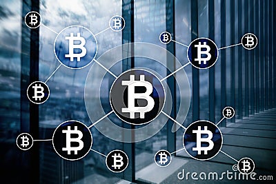 Bitcoin cryptocurrency and blockchain technology concept on blurred skyscrapers background Stock Photo