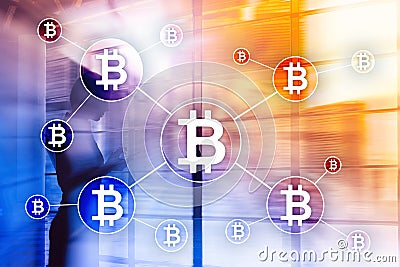 Bitcoin cryptocurrency and blockchain technology concept on blurred skyscrapers background. Stock Photo