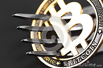 Bitcoin crytocurrency coin with fork Stock Photo
