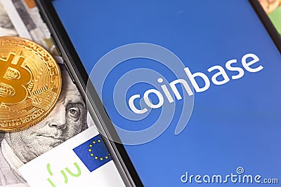 Bitcoin, dollars, euro banknotes and smartphone with Coinbase logo on the screen Editorial Stock Photo