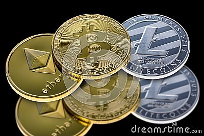 Bitcoin, ethereum and litecoin coins isolated on black background with reflection. Crypto currency electronic money for web bankin Editorial Stock Photo