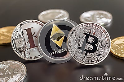Cryptocurrency coins Bitcoin, Ethereum, Litecoin Editorial Stock Photo