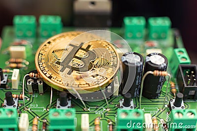 Bitcoin coin on circuit board Stock Photo