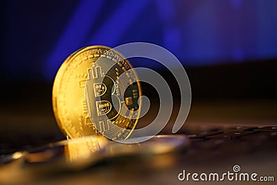 Bitcoin gold coin and defocused chart background. Stock Photo