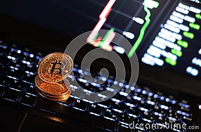 Bitcoin gold coin on a laptop Stock Photo