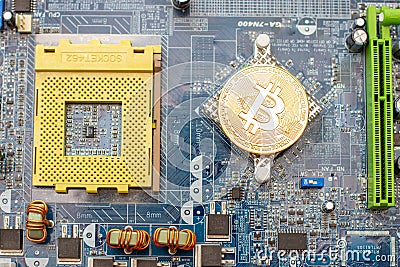 Bitcoin golden coin on computer chip. Editorial Stock Photo