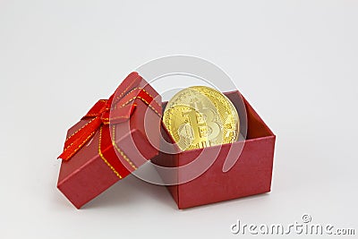 Bitcoin golden coin in a red gift box Stock Photo