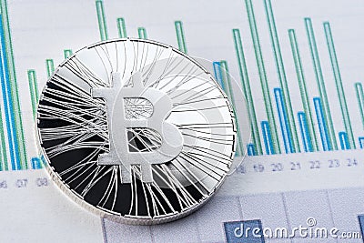 Bitcoin with graphics exchange rate on stock trade papers. Cryptocurrency, bitcoin invest chart Stock Photo