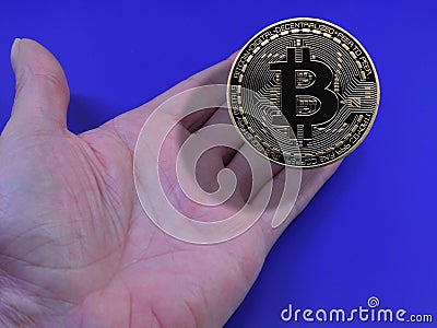 Bitcoin in hand Stock Photo
