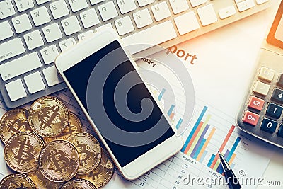 Bitcoin and its business-class laptop smartphones work and bring Stock Photo
