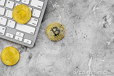 Bitcoin on keyboard for online payment on gray background top view space for text Stock Photo