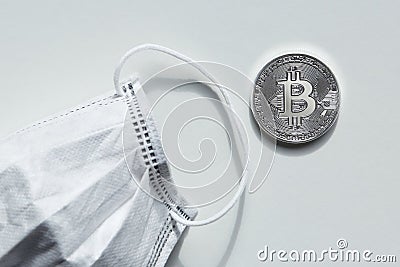 Bitcoin Next To Surgical Mask Editorial Stock Photo