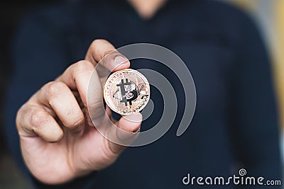 Bitcoin is an open source peer-to-peer electronic cash system that uses blockchain technology Stock Photo
