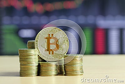 Bitcoin placed on stack gold coin of financial grown concept and Stock Photo