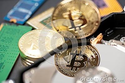 Bitcoin reflection on hard disk drive, cpu and ram stick in the background. Concept of crypto mining and digital currency Stock Photo