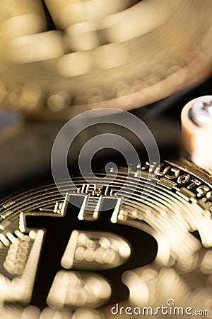 Bitcoin reflection on hard drive platter. Mining cryptocurrency concept. PC hardware with digital currency like bitcoin. Closeup Stock Photo