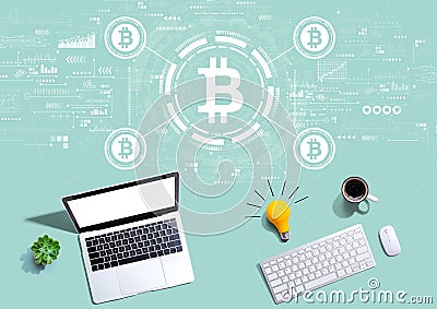 Bitcoin theme with computers with a light bulb Editorial Stock Photo