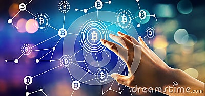 Bitcoin theme with hand pressing a button Stock Photo