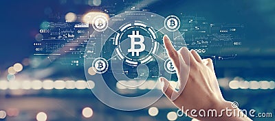 Bitcoin theme with hand pressing a button Stock Photo