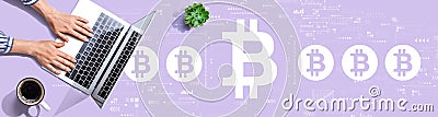 Bitcoin theme with person using a laptop Editorial Stock Photo