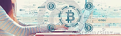Bitcoin theme with woman working on a laptop Stock Photo