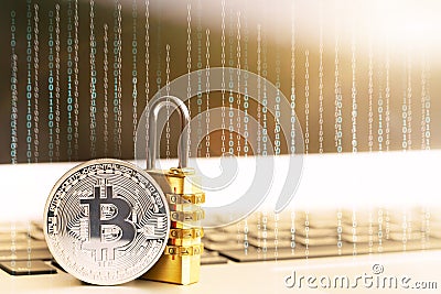 BitcoinBTC coin with padlock lying on computer background. Stock Photo