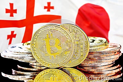 Bitcoins on Georgia and Japan flag background Stock Photo