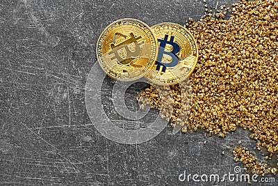 Bitcoins and gold nuggets on grunge background Stock Photo