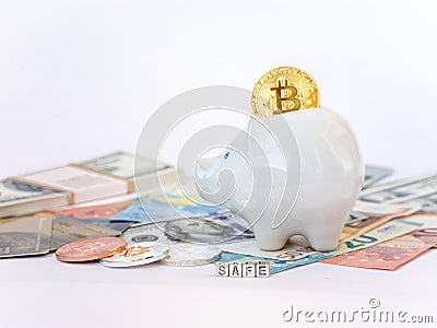 Bitcoins, New Virtual Money concept in piggy bank. Gold bitcoins with name Safe dollars` euros` background. Golden coins with ic Stock Photo