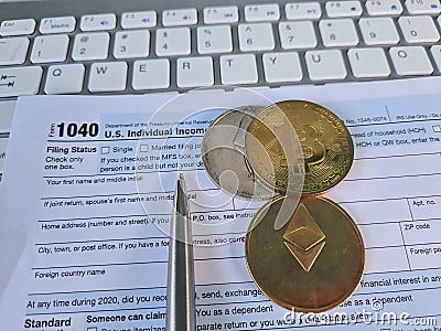 Bitcoins are reported on the US personal income tax return Form 1040 Stock Photo