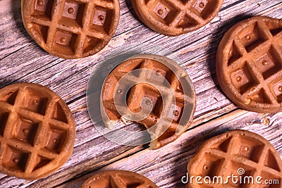 A bite-sized mini waffle among other perfect pieces. Stock Photo