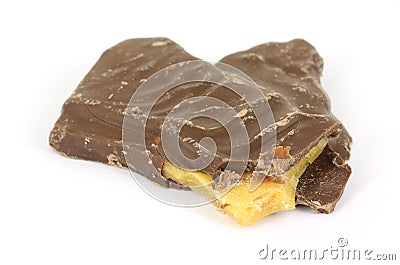 Bitten chocolate covered peanut brittle Stock Photo