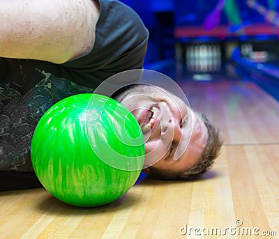 Drunk man on bowling alley Stock Photo