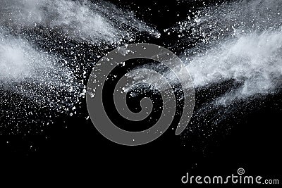 Bizarre forms of white powder explosion cloud against dark background. Stock Photo