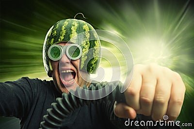 Bizarre man in a helmet from a watermelon Stock Photo