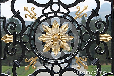 Black ad gold wrought iron gate Stock Photo