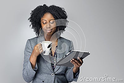 Black Female Businesswoman Keynote Speaker Posing with a Tablet and Coffee Stock Photo