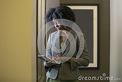 Black African American Female Businesswoman with a Tablet Stock Photo