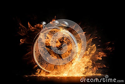 A black alarm clock with large numbers on a dark background surrounded by burning hot particles Stock Photo