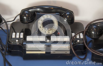 Black antique telephone. Vintage old telephone on desk Stock Photo