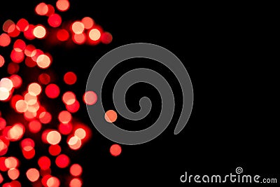 Black background with bright red warm bokeh lights. Holiday, Valentines, Christmas and New Year background. Ideal to Stock Photo