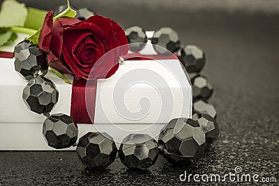 black background with gift box and necklace Stock Photo