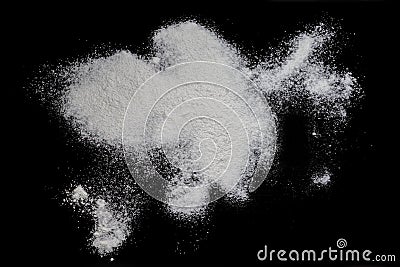 Black background sprinkled with flour, smeared flour, table for cooking, rolling dough. Stock Photo