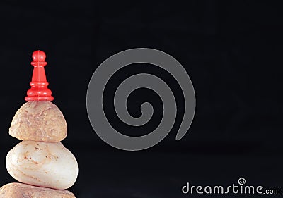 black backgrouund top view of red pawn Stock Photo