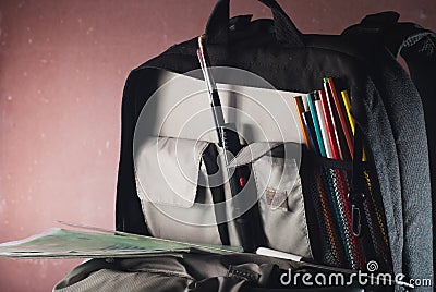 Black backpack with skolkimi items, back to school, Stock Photo