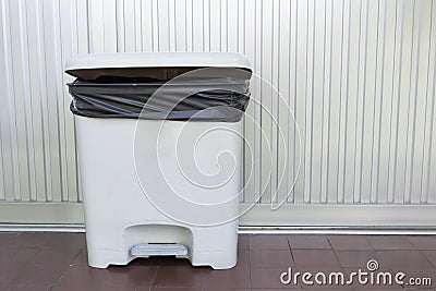 Black bag plastic in white trashcan Stock Photo