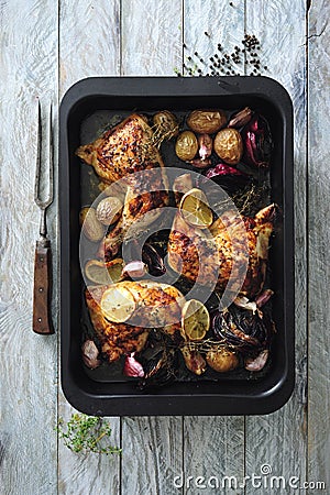 Hot and spicy glazed chicken legs baked with onions and garlic Stock Photo