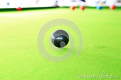 Black ball, Snooker Player. Stock Photo